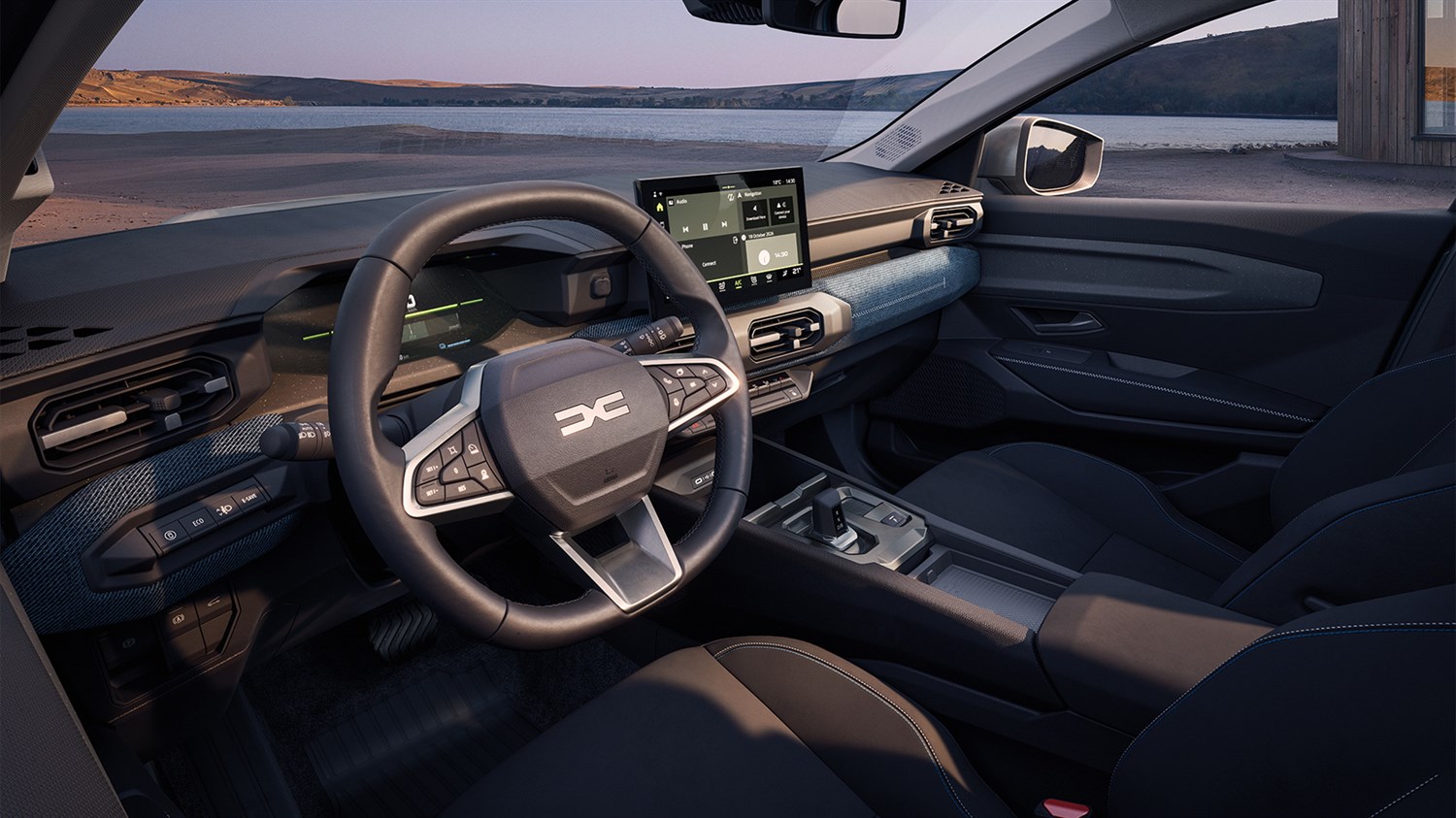 Unutrašnjost vozila Dacia Striker s prikazom upravljača, digitalnog zaslona i moderne armaturne ploče.